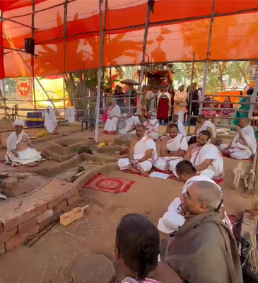 Brahmin priests sitting at the Soma Yagna.
